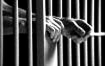 prison_hands_through_bars1.jpg